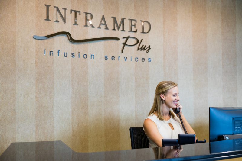 Intramed Plus female employee answering phone