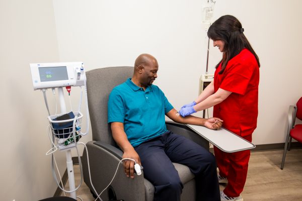 Infusion nurse administering infusion 