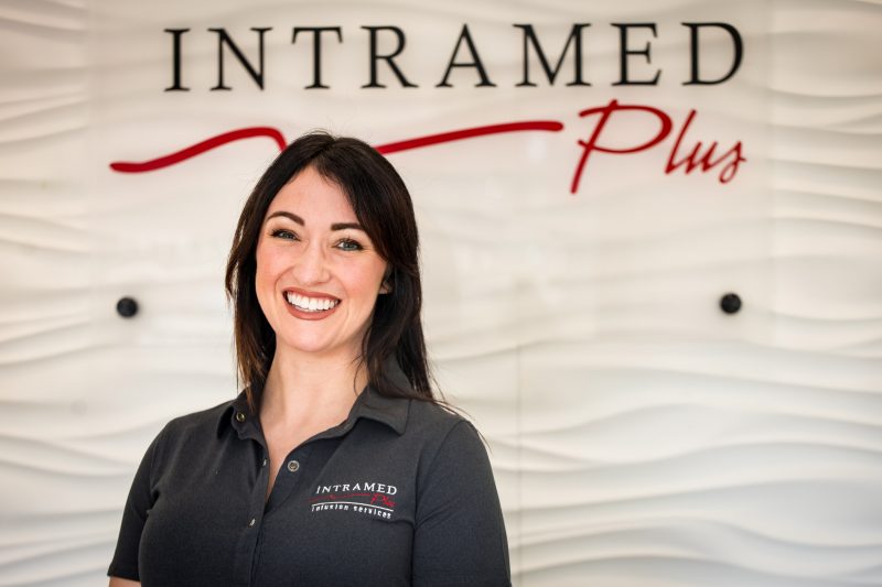 Intramed Plus employee looking into the camera